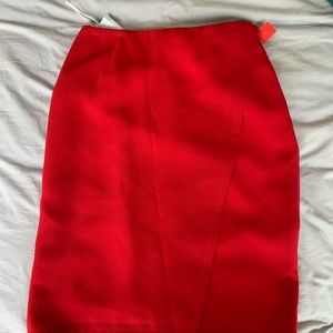 Knee length red skirt